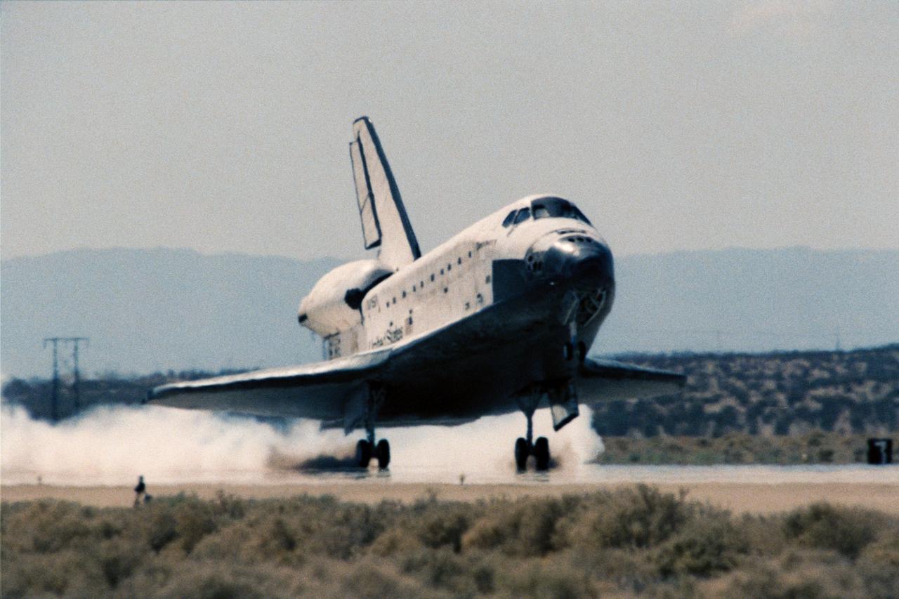 STS64-S-094 (20 Sept. 1994) --- The space shuttle Discovery, with a crew of six NASA astronauts aboard, touches down on Runway 04 at Edwards Air Force Base (EAFB), completing a 10-day, 22-hour and 50-minute mission.  Following a de-orbit engine firing at 1:14 p.m. (PDT), Sept. 20, 1994. Touchdown was at 2:12:59 p.m., and the nose wheel touched down at 2:13:03 p.m., with wheel stop at 2:13:52 p.m. Bad weather in Florida called for an "eleventh hour" shift to the California landing site. Onboard for the flight, whose mission was to study Earth's atmosphere and to test tools and procedures for the International Space Station, were astronauts Richard N. Richards, L. Blaine Hammond Jr., Mark C. Lee, Carl J. Meade, Susan J. Helms and Jerry M. Linenger. Photo credit: NASA or National Aeronautics and Space Administration