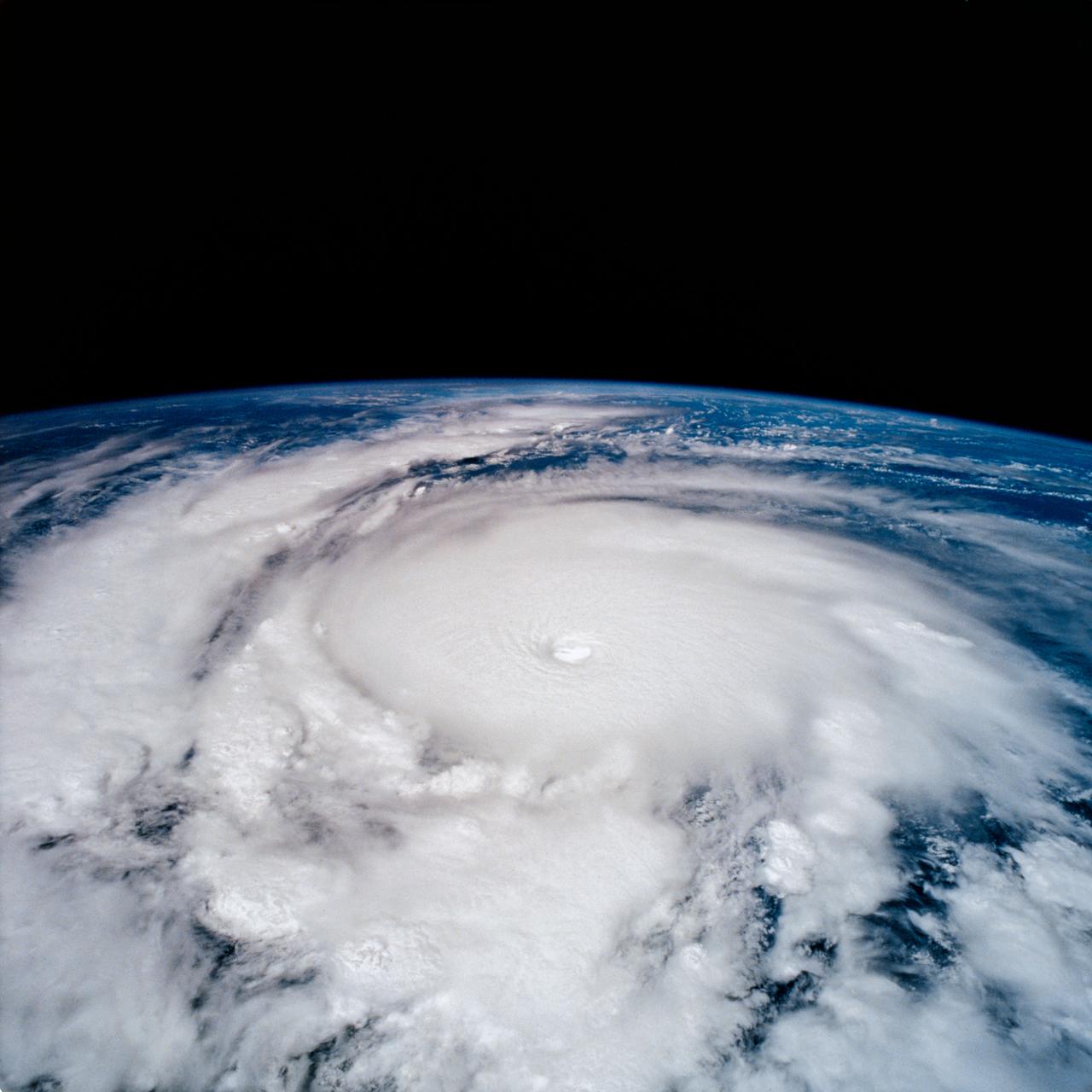 STS-65 Earth observation taken aboard Columbia, Orbiter Vehicle (OV) 102, shows Hurricane Emilia in the Eastern Pacific Ocean. Hurricane Emilia's wind speeds exceeded 150 knots. This high oblique view of the storm shows numerous spiral bands of thunderstorms, overshooting thunderstorm tops at the tropopause, and a well developed eye at the center of the picture. Shuttle photography provides high resolution details of these powerful and destructive systems that are not fully possible from lower-resolution, unmanned satellites.