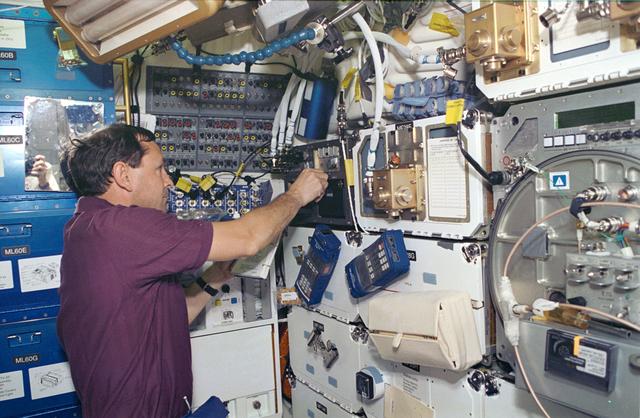 NASA image: Astronaut Curtis Brown works with SAMS on Shuttle Atlantis middeck