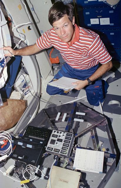 NASA image: Astronaut Donald McMonagle works with HPP-2 experiment on middeck