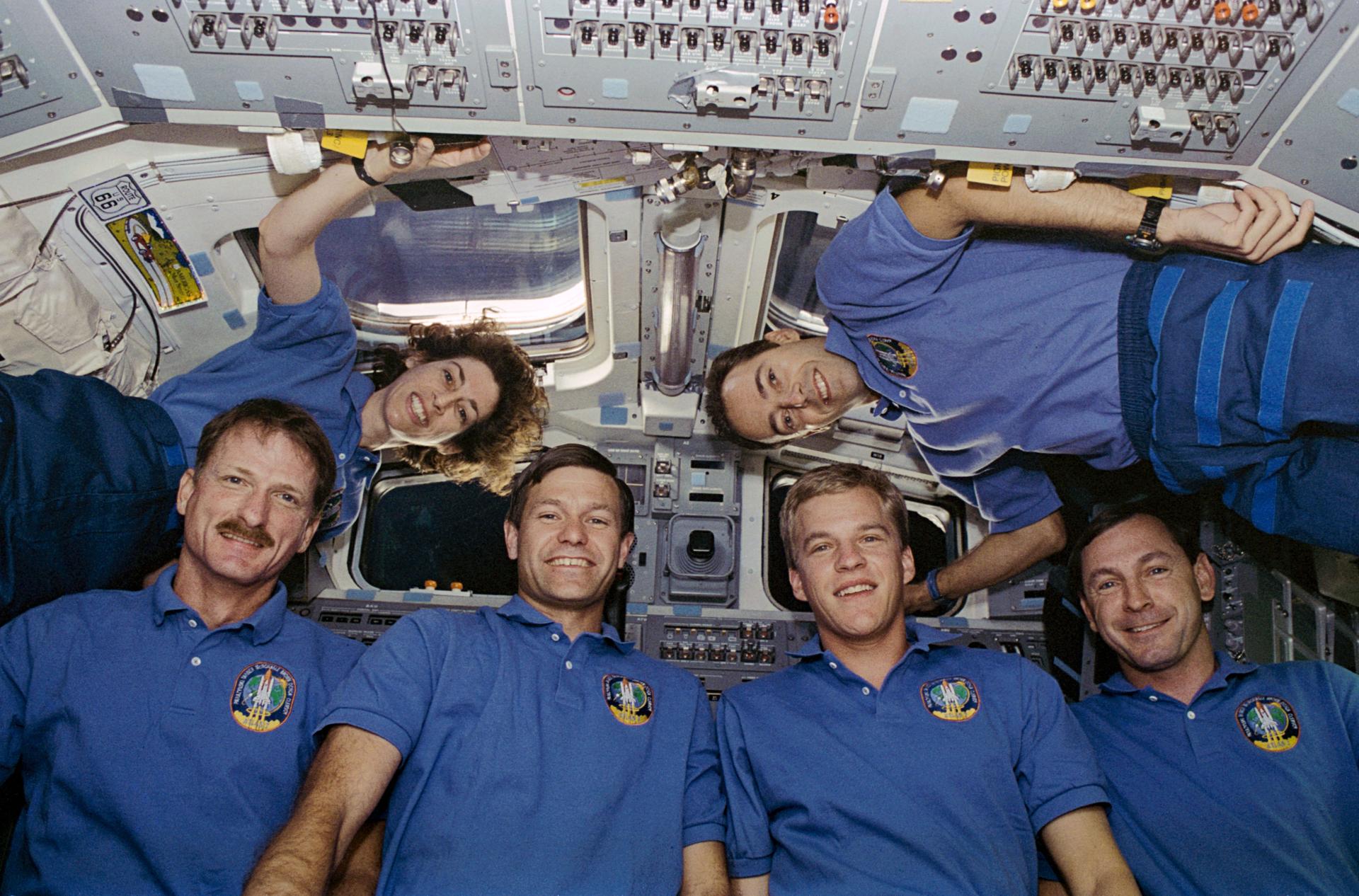 STS-66 crew floating onboard the shuttle