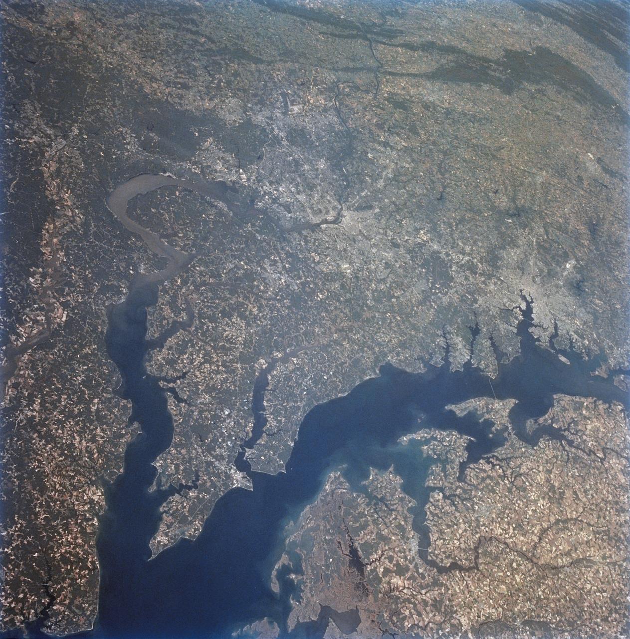 STS068-234-044 (30 September-11 October 1994) --- From the wetlands in Maryland to the nation's capital and onto Baltimore, this 70mm photograph from the Space Shuttle Endeavour shows some details of the historic Chesapeake Bay and Potomac River area.  With the rather low altitude of Endeavour at 115 nautical miles, features as small as Kennedy Memorial Stadium and Andrews Air Force Base are clearly seen.