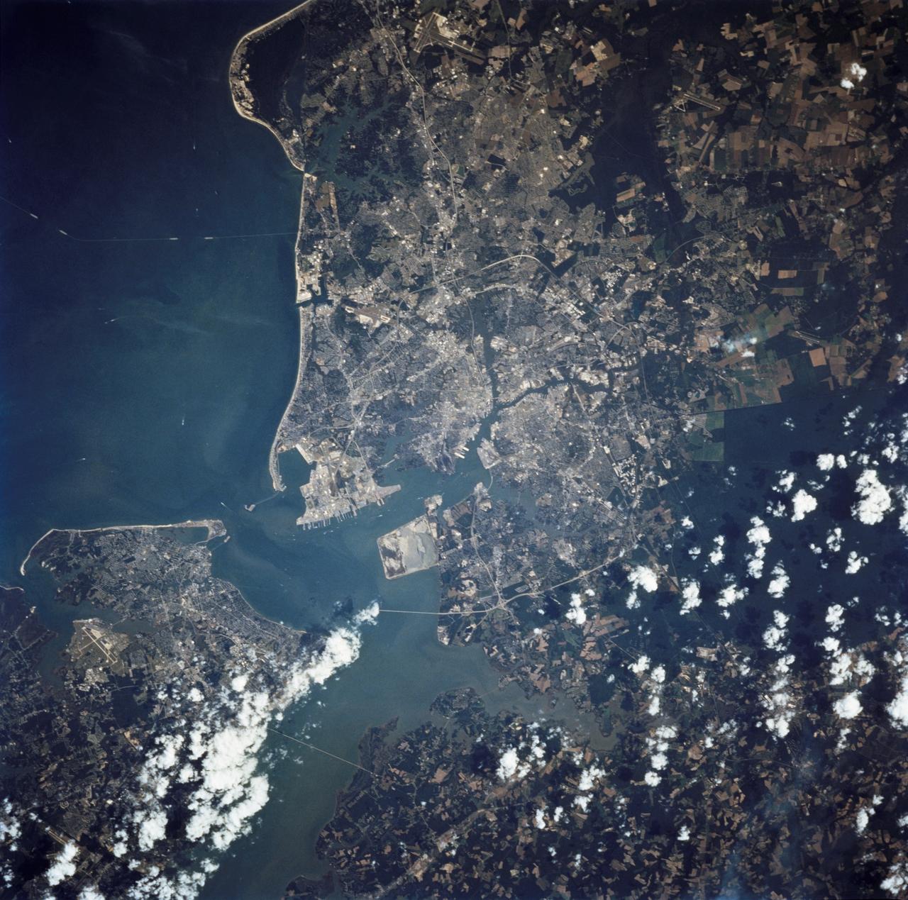 STS068-237-055 (30 September - 11 October 1994) --- This coastal area, considered home by astronaut Peter J. K. (Jeff) Wisoff, was photographed from the Space Shuttle Endeavour during the Space Radar Laboratory (SRL-2) mission. Wisoff, a native of Norfolk, talked about this area during a post-flight crew awards and presentation event at the Johnson Space Center (JSC). He pointed out that the waterways are heavily used for commercial, recreational and military purposes. Piers near the mouth of the Elizabeth River are associated with the U. S. Naval Base and those down river support the activities of the city of Norfolk. Seashore State Park and the Ft. Story Military Reservation are visible at the mouth of the Chesapeake.