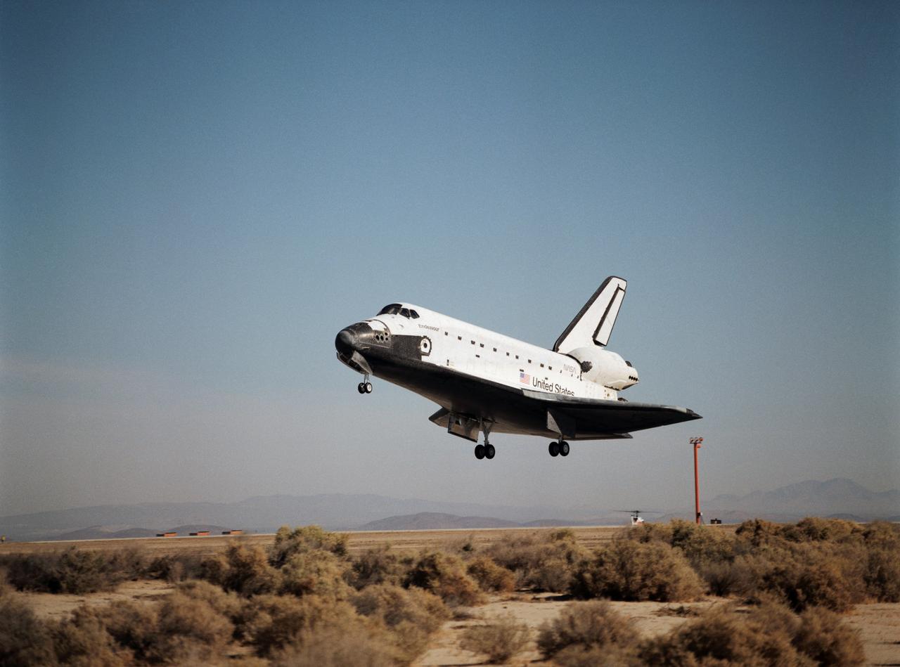 STS068-S-060 (11 October 1994) --- With its main landing gear not quite on the runway, the Space Shuttle Endeavour wraps up an eleven-day mission at Edwards Air Force Base, California.  Landing occurred at 10:02 a.m. (PDT), October 11, 1994.  Onboard were astronauts Michael A. Baker, mission commander; Terrence W. Wilcutt, pilot; Thomas D. Jones, payload commander; and Daniel W. Bursch, Peter J. K. (Jeff) Wisoff and Steven L. Smith, all mission specialists.