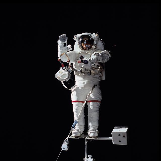 NASA image: Astronaut James S. Voss stands on foot restraint attached to RMS
