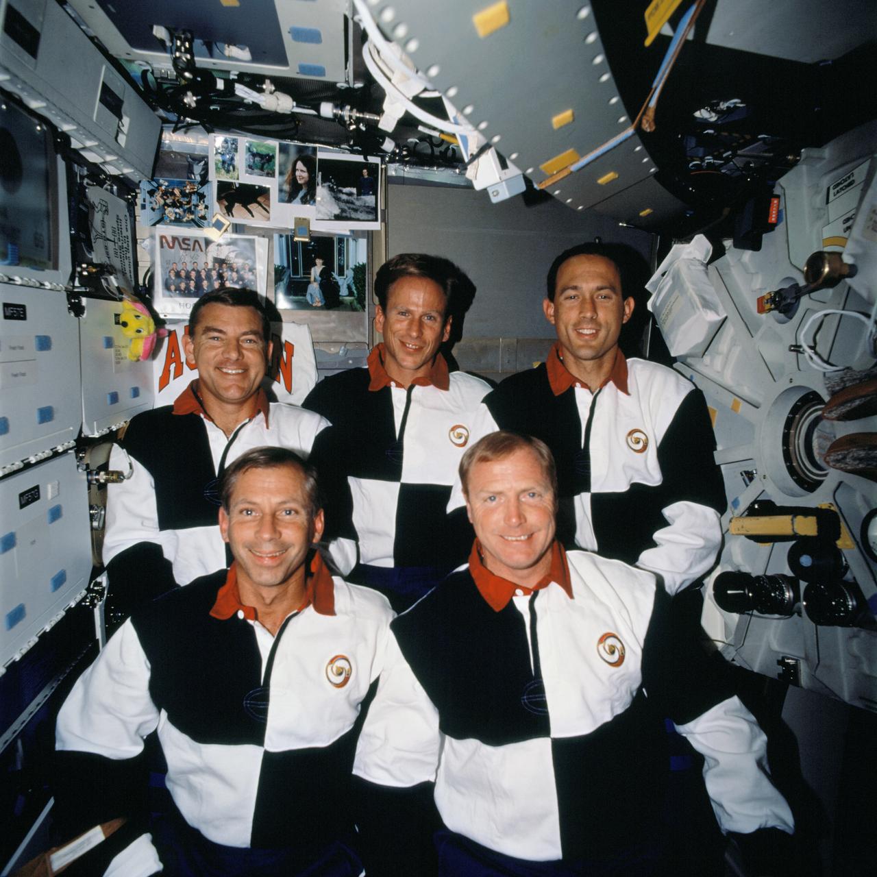 STS069-715-050 (7-18 September 1995) --- The STS-69 crewmembers take a moment from a busy flight to pose for the traditional in-flight crew portrait on the middeck of the Earth-orbiting Space Shuttle Endeavour. Left to right on the front row are astronauts Kenneth D. Cockrell, pilot; and David M. Walker, mission commander. Left to right on the back row are astronauts James S. Voss (payload commander), Michael L. Gernhardt and James H. Newman, all mission specialists. Endeavour with a five-member crew, launched on September 7, 1995, from the Kennedy Space Center (KSC). The mission ended September 18, 1995, with a successful landing on Runway 33 at KSC.