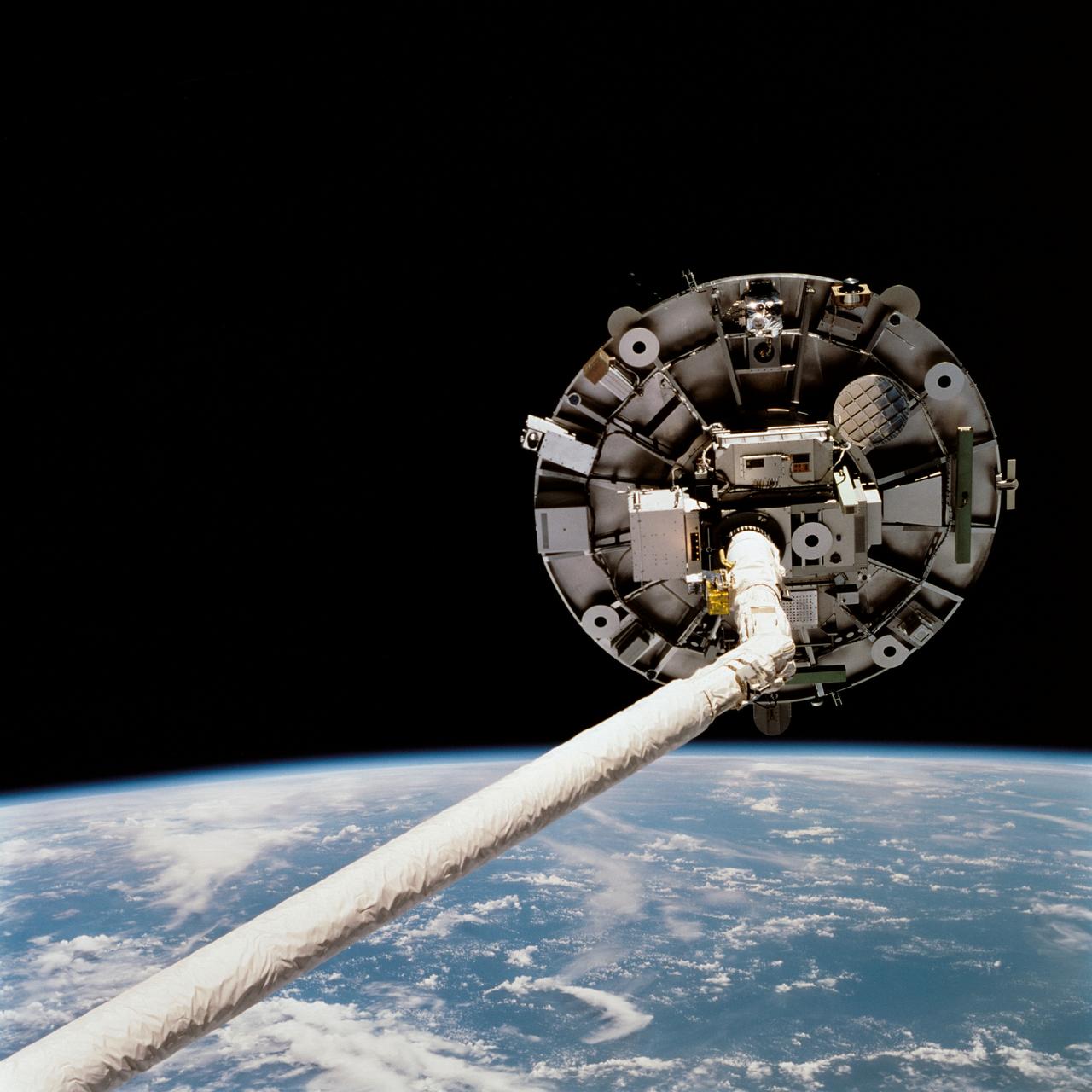 STS069-723-072 (11 September 1995) --- Prior to being released by Space Shuttle Endeavour's Remote Manipulator System (RMS) for a period of time, the Wake Shield Facility (WSF) is backdropped against the darkness of space over a blue and white Earth. The picture was taken shortly after midnight Houston time on September 11, 1995.  The Endeavour, with a five-member crew, launched on September 7, 1995, from the Kennedy Space Center (KSC) and ended its mission there on September 18, 1995, with a successful landing on Runway 33. The multifaceted mission carried a crew of astronauts David M. Walker, mission commander; Kenneth D. Cockrell, pilot; and James S. Voss (payload commander), James H. Newman and Michael L. Gernhardt, all mission specialists.