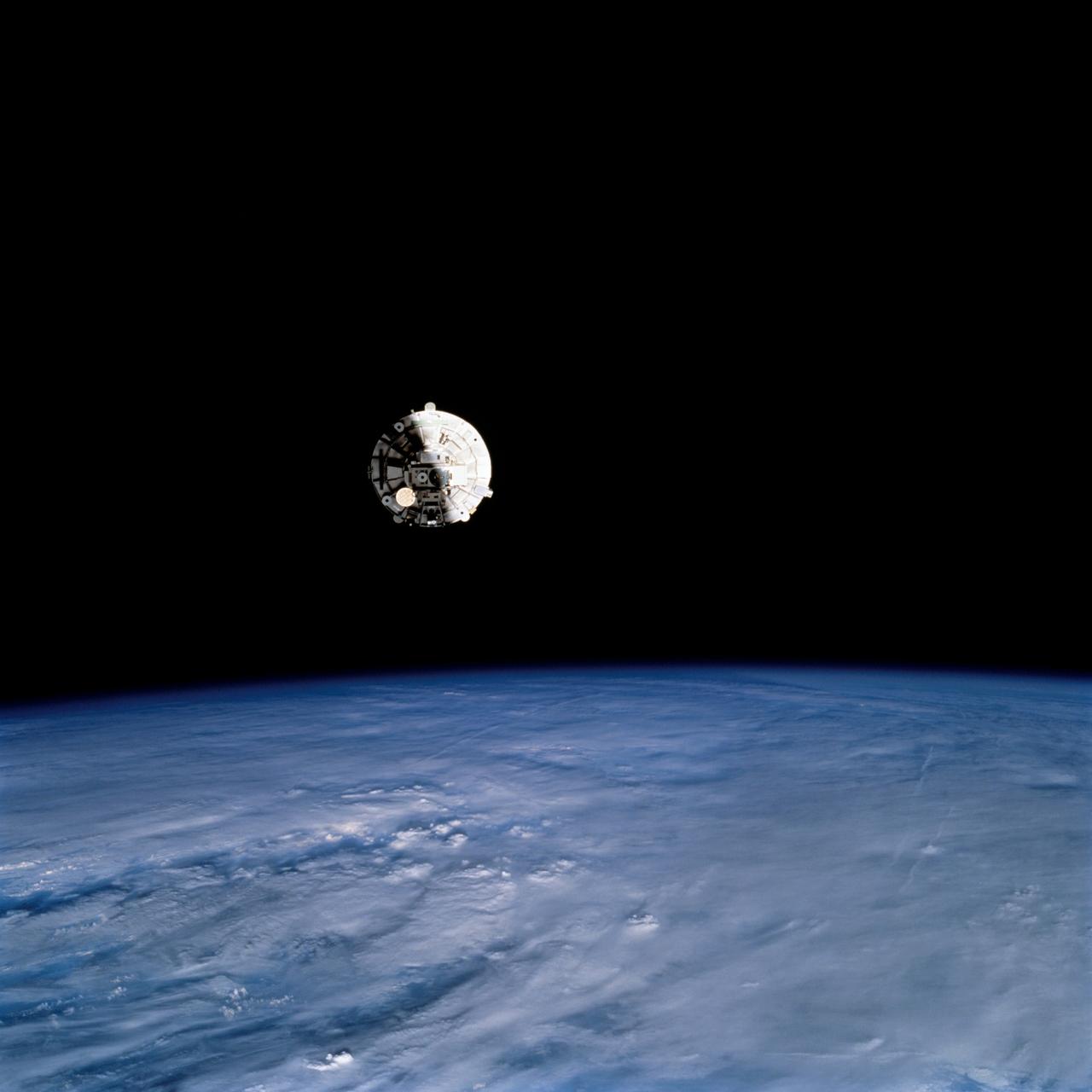 STS069-724-095 (7-18 September 1995) --- Prior to being re-captured by Space Shuttle Endeavour's Remote Manipulator System (RMS), the Wake Shield Facility (WSF) was recorded on film, backdropped against the darkness of space over a heavily cloud-covered Earth.  Endeavour, with a five-member crew, launched on September 7, 1995, from the Kennedy Space Center (KSC) and ended its mission there on September 18, 1995, with a successful landing on Runway 33. The multifaceted mission carried a crew of astronauts David M. Walker, mission commander; Kenneth D. Cockrell, pilot; and James S. Voss (payload commander), James H. Newman and Michael L. Gernhardt, all mission specialists.