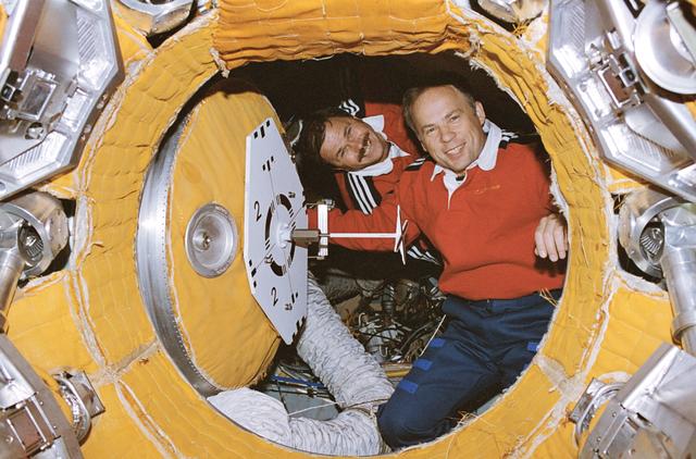 NASA image: Solovyev and Budarin prepare to close hatch to docking module