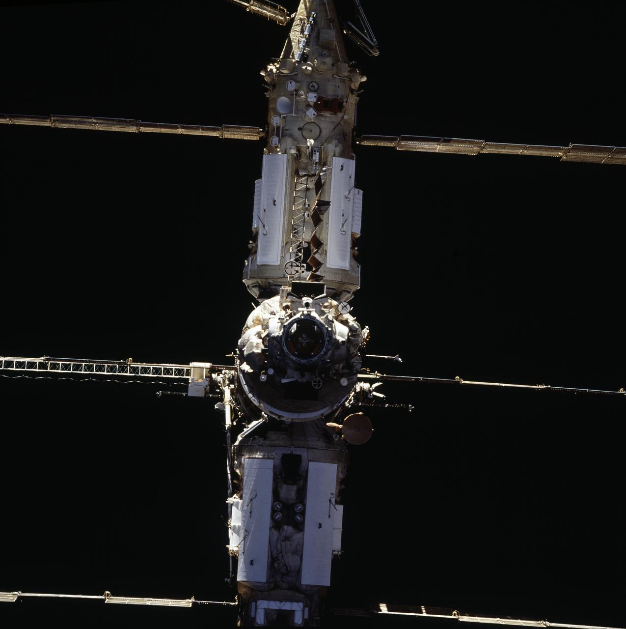 STS071-701-025 (29 June 1995) --- The approach for the June 29, 1995, link-up of the Russian Mir Space Station and the space shuttle Atlantis was recorded with a 70mm handheld camera from the aft flight deck of the Space Shuttle Atlantis. The Androgynous Peripheral Docking System (APDS) and the Kristall Module on Mir are at center frame. Later, five NASA astronauts and two Russian cosmonauts boarded Mir. The occasion was just two and a half weeks prior to the 20th anniversary of the Apollo-Soyuz Test Project (ASTP) docking in Earth-orbit.