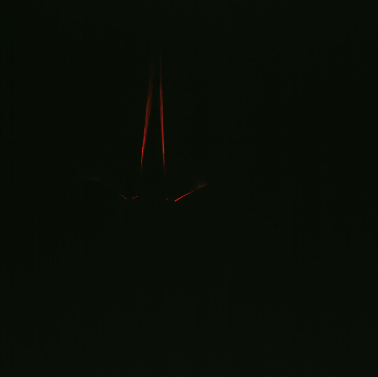 STS071-702-009 (27 June-7 July 1995) --- A time exposure on a 70mm camera was used to provide this unusual scene of the vertical stabilizer and part of the Orbital Maneuvering Systems (OMS) pods on the Earth-orbiting space shuttle Atlantis. This type exposure is part of NASA's ongoing evaluation of the interaction of oxygen with materials in low Earth-orbit.