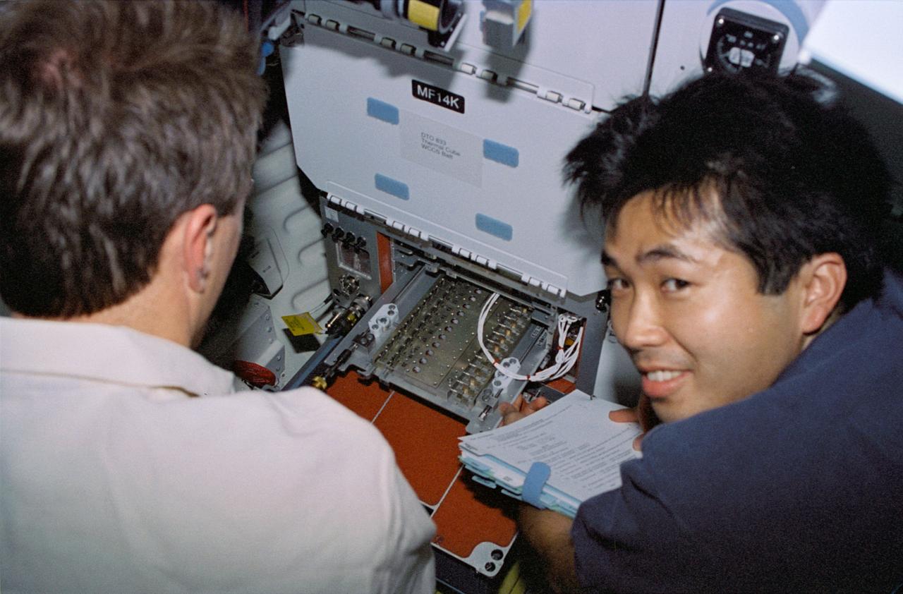 STS072-310-007 (11-20 Jan. 1996) --- Astronauts Brent W. Jett Jr. (left) and Koichi Wakata work with the Protein Crystal Growth (PCG) experiment at the Single Locker Thermal Enclosure System (STES) on the Space Shuttle Endeavour’s mid-deck. Jett, making his first flight in space, served as the crew’s pilot, while Wakata served as a mission specialist. Wakata, also a first time Shuttle crew member, represents Japan’s National Space Development Agency (NASDA).
