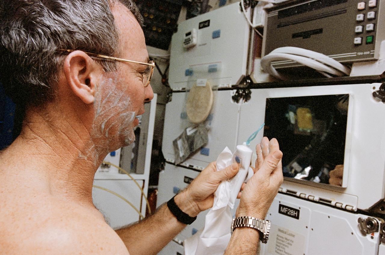 STS072-331-016 (11-20 Jan. 1996) --- On the Space Shuttle Endeavour’s middeck, astronaut Brian Duffy, mission commander, shaves. Duffy was joined on the week and a half long mission by four United States astronauts and a mission specialist representing Japan’s National Space Development Agency (NASDA).