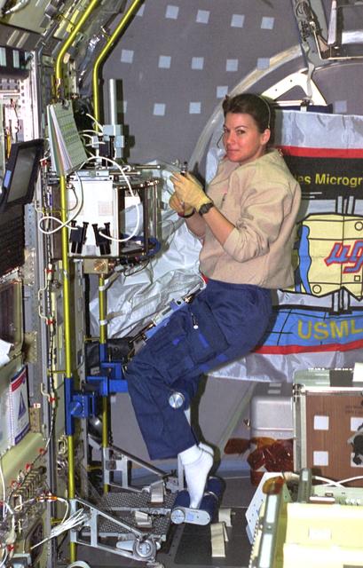 NASA image: PCG-GBX, Mission Specialist Catherine "Cady" Coleman works at glovebox