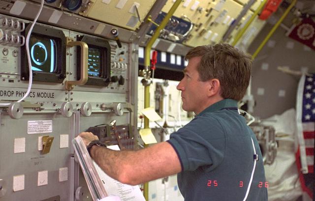 NASA image: DPM, Payload Specialist Fred Leslie working in Spacelab