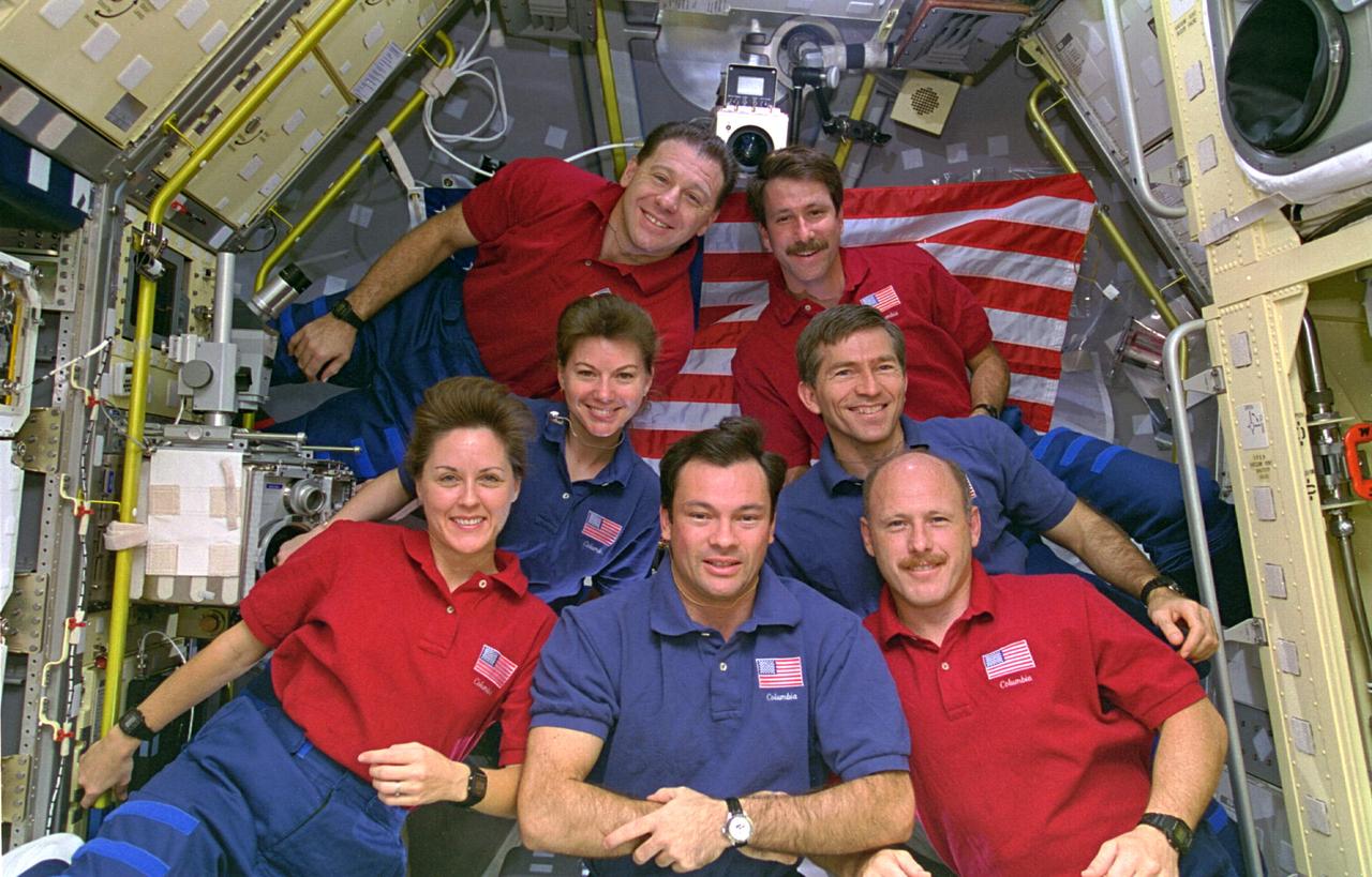 STS073-303-015 (20 October - 5 November 1995) --- The crew members picked the site of their busy workdays as the setting for the traditional in-flight crew portrait, as personnel from both work shifts assembled in the science module supporting the U.S. Microgravity Laboratory (USML-2) mission. Astronaut Michael E. Lopez-Alegria, mission specialist, has his arms folded at front center. The others pictured, counter-clockwise from that point, are Kathryn C. Thornton, payload commander; Catherine G. Coleman, mission specialist; Albert Sacco, payload specialist; Kent V. Rominger, pilot; Fred W. Leslie, payload specialist; and Kenneth D. Bowersox, mission commander.