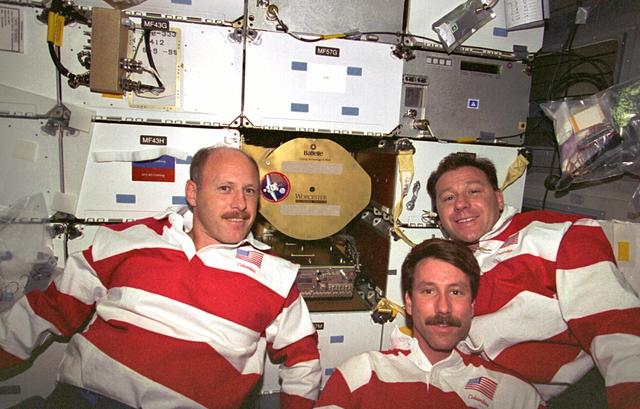 STS073-337-021 (20 October - 5 November 1995) --- Three members of the crew check out the Zeolite Crystal Growth (ZCG) on the middeck of the Earth-orbiting Space Shuttle Columbia. Left to right are astronauts Kenneth D. Bowersox and Kent V. Rominger, mission commander and pilot, respectively, and payload specialist Albert Sacco Jr. ZCG evaluated Zeolite crystallization and growth in the microgravity environment aboard Columbia in order to achieve high yields of large, nearly perfect crystals in space. Zeolites are complex arrangements of silica and alumina that occur naturally as well as synthetically.
