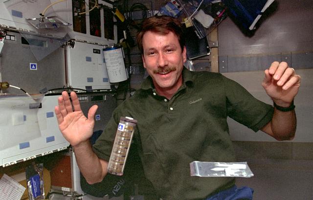 NASA image: PCG, Pilot Kent Rominger transfers protein crystal vials to Sacco in Spacelab