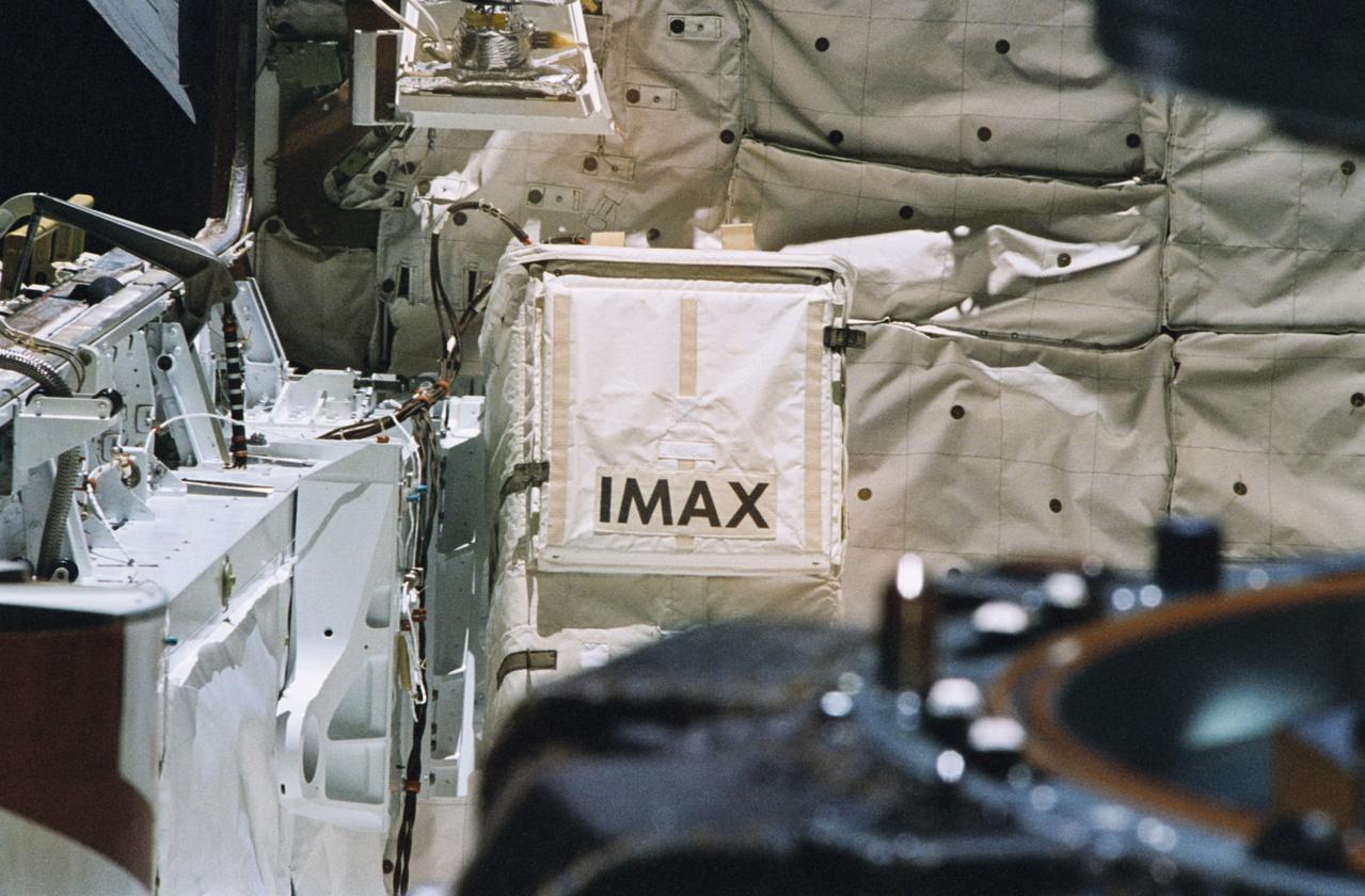 STS074-361-035 (12-20 Nov 1995) --- This medium close-up view centers on the IMAX Cargo Bay Camera (ICBC) and its associated IMAX Camera Container Equipment (ICCE) at its position in the cargo bay of the Earth-orbiting Space Shuttle Atlantis.  With its own ?space suit? or protective covering to protect it from the rigors of space, this version of the IMAX was able to record scenes not accessible with the in-cabin cameras.  For docking and undocking activities involving Russia?s Mir Space Station and the Space Shuttle Atlantis, the camera joined a variety of in-cabin camera hardware in recording the historical events.  IMAX?s secondary objectives were to film Earth views.  The IMAX project is a collaboration between NASA, the Smithsonian Institution?s National Air and Space Museum (NASM), IMAX Systems Corporation, and the Lockheed Corporation to document significant space activities and promote NASA?s educational goals using the IMAX film medium.