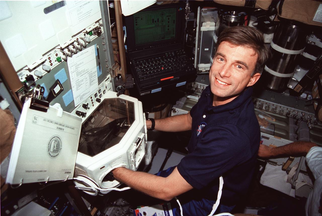 STS076-312-022 (22 - 31 March 1996) --- Astronaut Ronald M. Sega, payload commander, works in the glovebox facility in the Spacehab laboratory aboard the Earth-orbiting Space Shuttle Atlantis.  The Spacehab facility was one of the busier research areas on Atlantis during the STS-76 mission.  Also, some of the gear for transfer to Russia's Mir Space Station was stowed there prior to the March 23, 1996 docking of Atlantis and Mir.