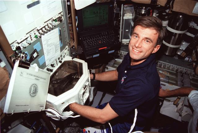 NASA image: Biorack, Astronaut Ron Sega works in Spacehab glovebox
