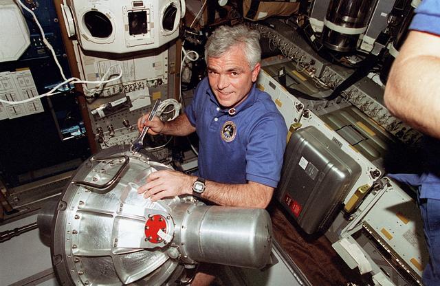 NASA image: Clifford removes bolts on new Russian gyrodyne to be transferred to Mir