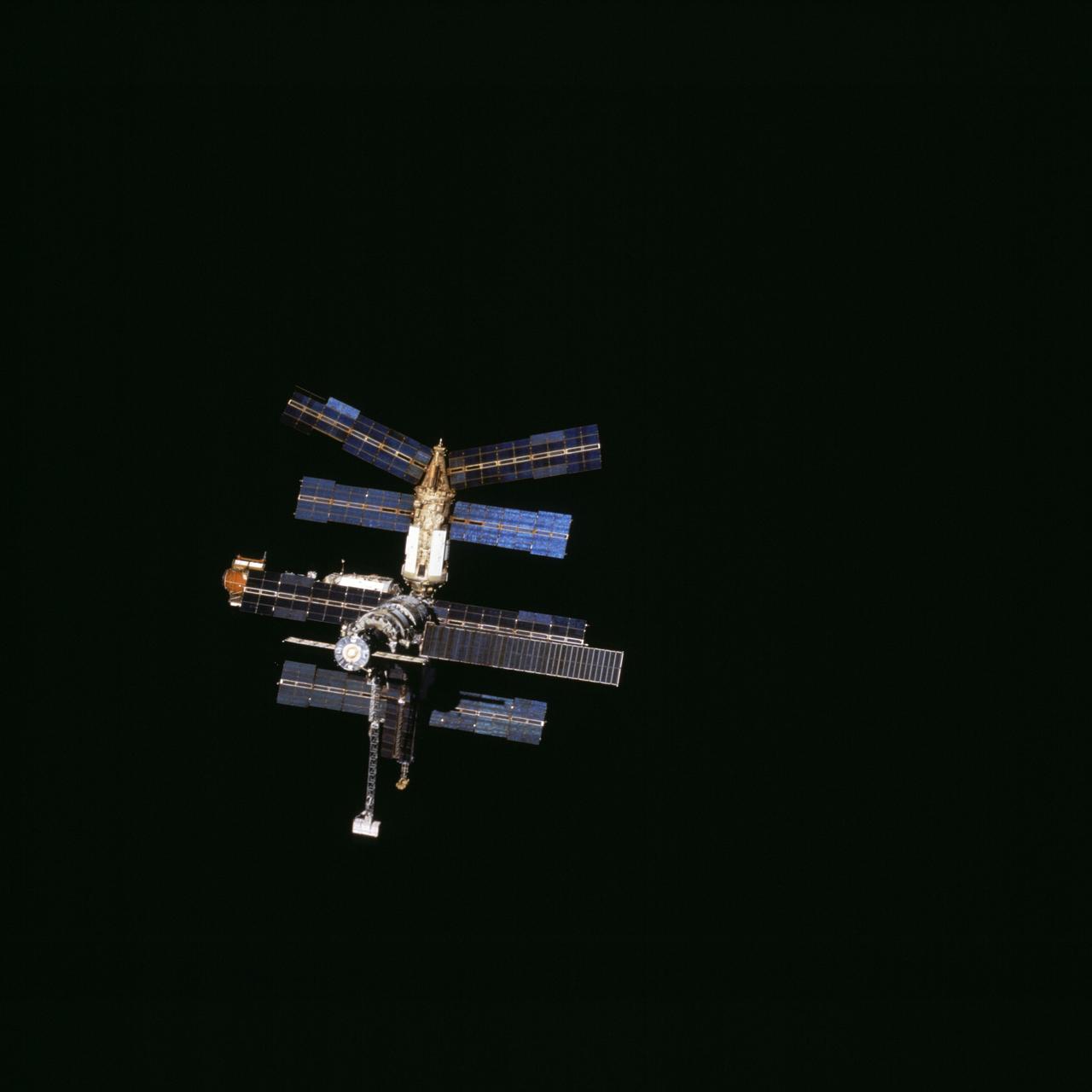 STS076-713-092 (28 March 1996) --- The crew took this 70mm picture of Russia's Mir Space Station during a final "fly-around" following separation of the two spacecraft on March 28, 1996. The two spacecraft had docked on March 23, 1996, at which time Shannon W. Lucid joined two cosmonauts onboard for the first leg of a 140-day stay onboard Mir, as a cosmonaut guest researcher. Photo credit: NASA or National Aeronautics and Space Administration