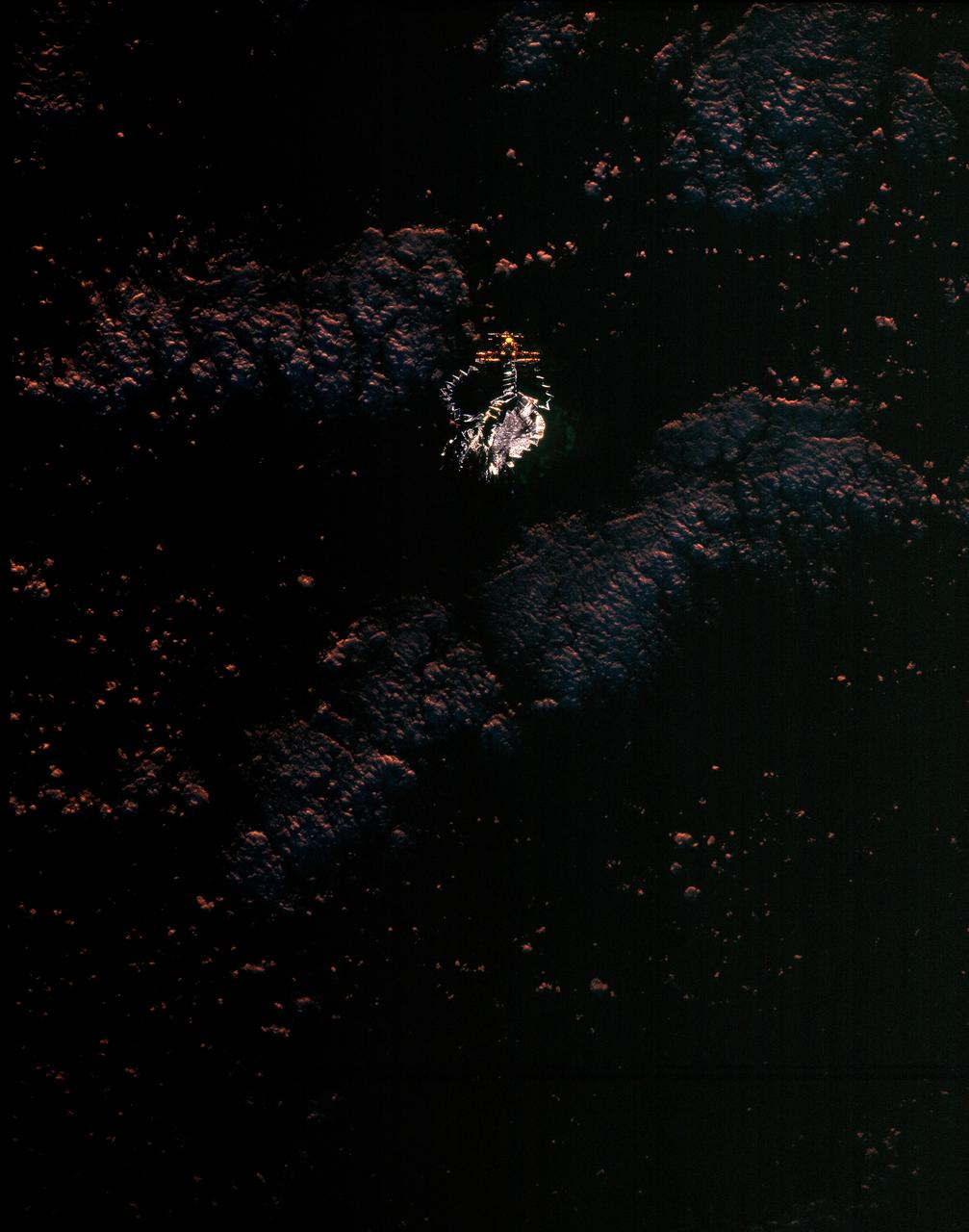 STS077-150-010 (20 May 1996) --- Soon after leaving the cargo bay of the Space Shuttle Endeavour, the Spartan 207/Inflatable Antenna Experiment (IAE) payload goes through its inflation process, backdropped over clouds.  The view was photographed with a large format still camera on the first full day of in-space operations by the six-member crew.  Managed by Goddard Space Flight Center (GSFC), Spartan is designed to provide short-duration, free-flight opportunities for a variety of scientific studies.  The Spartan configuration on this flight is unique in that the IAE is part of an additional separate unit which is ejected once the experiment is completed.  The IAE experiment will lay the groundwork for future technology development in inflatable space structures, which will be launched and then inflated like a balloon on-orbit.