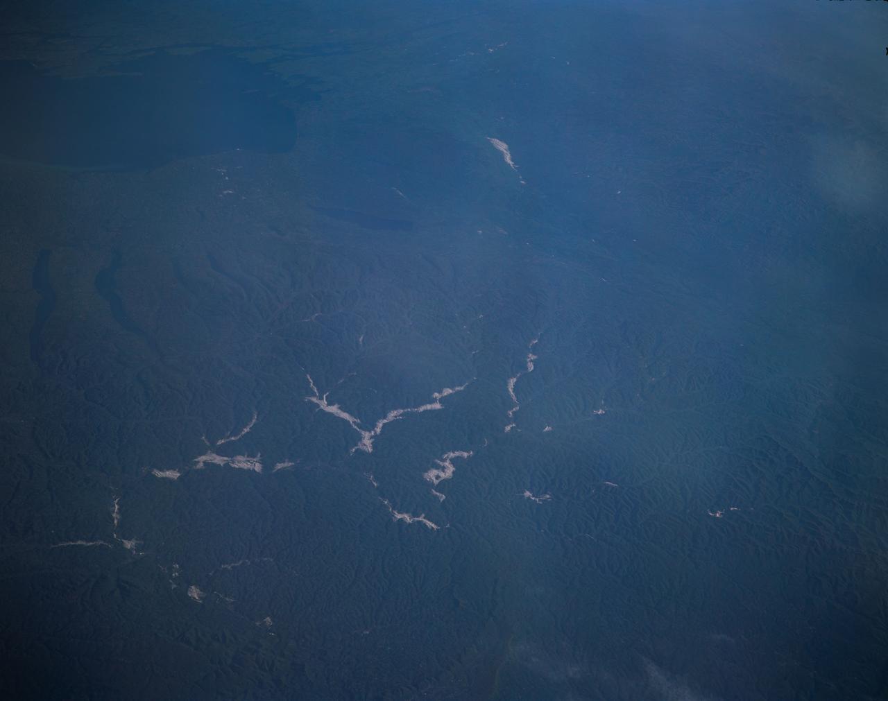 STS077-162-036 (19-29 May 1996) --- An oblique view of eastern New York State, Lake Ontario and the Saint Lawrence River.  This view of New York State looking northeast was provided by the crew members of the mission.  The Linhof camera, a 4x5 format instrument, provides a wide panorama of the region.  If the picture is oriented with the NASA logo to the left bottom corner, North will be to the upper side of the frame.  Lake Ontario is in the upper left corner and the Catskills are in the lower portion of the scene.  The Finger Lakes from Cayuga to Oneida are in the left-center.  One of the remarkable aspects of this photograph is this part of New York only averages 68 cloud free days per year.  According to scientists studying the photo collection, the entire area of this photograph was covered by glaciers during the ice ages.  The glaciers left their marks in the creation of the Finger Lakes and the formation of Lake Ontario.