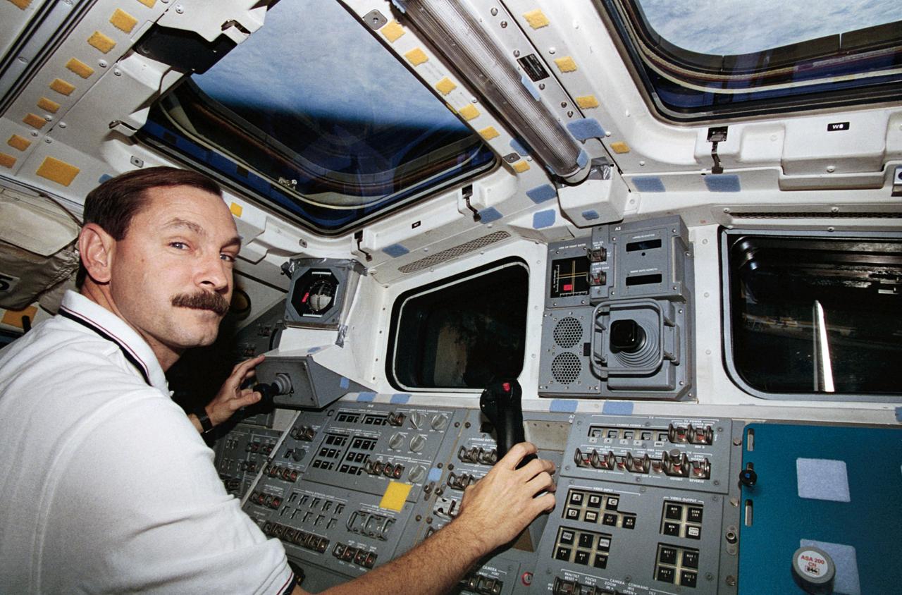 STS077-312-015 (19-29 May 1996) --- Astronaut Curtis L. Brown, Jr., pilot, mans the controls for the Remote Manipulator System (RMS) on the Space Shuttle Endeavour?s aft flight deck during rendezvous operations.  During the flight, the six-member crew was involved in deployment and rendezvous operations with the Spartan 207/Inflatable Antenna Experiment (IAE) as well as the Passive Aerodynamically Stabilized Magnetically Damped Satellite (PAMS)/Satellite Test Unit (STU).