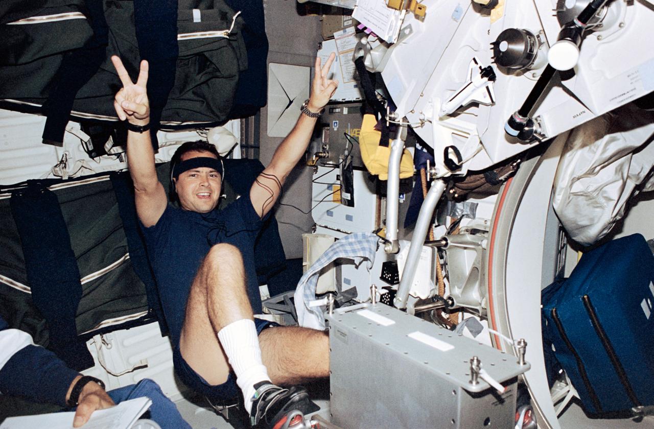 STS077-365-010 (19-29 May 1996) --- Astronaut Daniel W. Bursch, mission specialist, works out on the bicycle ergometer on Space Shuttle Endeavour’s middeck. Bursch joined five other NASA astronauts for the Spacehab-4 mission - his third space flight.