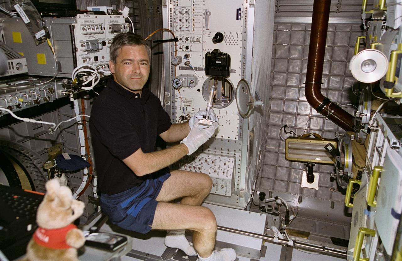 STS077-392-033 (19-29 May 1996) --- Astronaut Marc Garneau, mission specialist, works at the Commercial Float Zone Furnace (CFZF) in the Spacehab Module onboard the Space Shuttle Endeavour.  Garneau, representing the Canadian Space Agency (CSA), and five other astronauts went on to spend almost ten-days aboard Endeavour in support of the Spacehab 4 mission and a number of other payloads.
