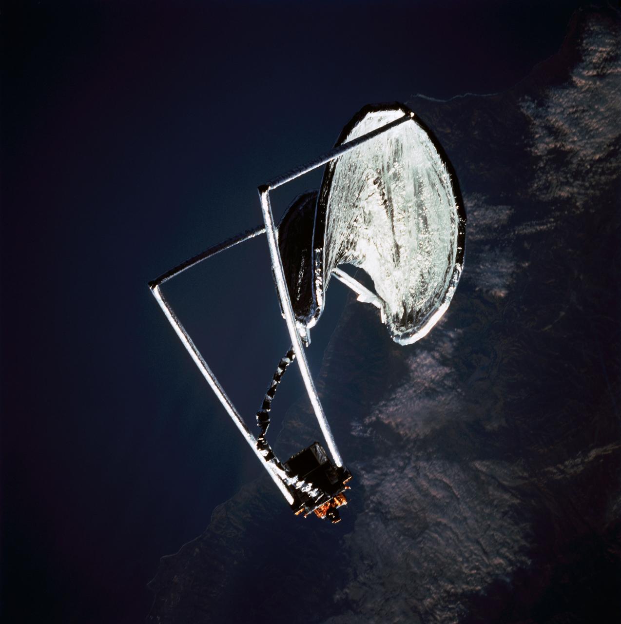 STS077-705-016 (20 May 1996) --- Following its deployment from the Space Shuttle Endeavour, the Inflatable Antenna Experiment (IAE) part of the Spartan 207 payload nears completion of its inflation process over California?s Pacific Coast near Santa Barbara and Point Conception.  The view was photographed with a handheld 70mm camera during the first full day of orbital operations by the six-member crew.  Managed by Goddard Space Flight Center (GSFC), Spartan is designed to provide short-duration, free-flight opportunities for a variety of scientific studies.  The Spartan configuration on this flight is unique in that the IAE is part of an additional separate unit which is ejected once the experiment is completed.  The IAE experiment will lay the groundwork for future technology development in inflatable space structures, which will be launched and then inflated like a balloon on-orbit.