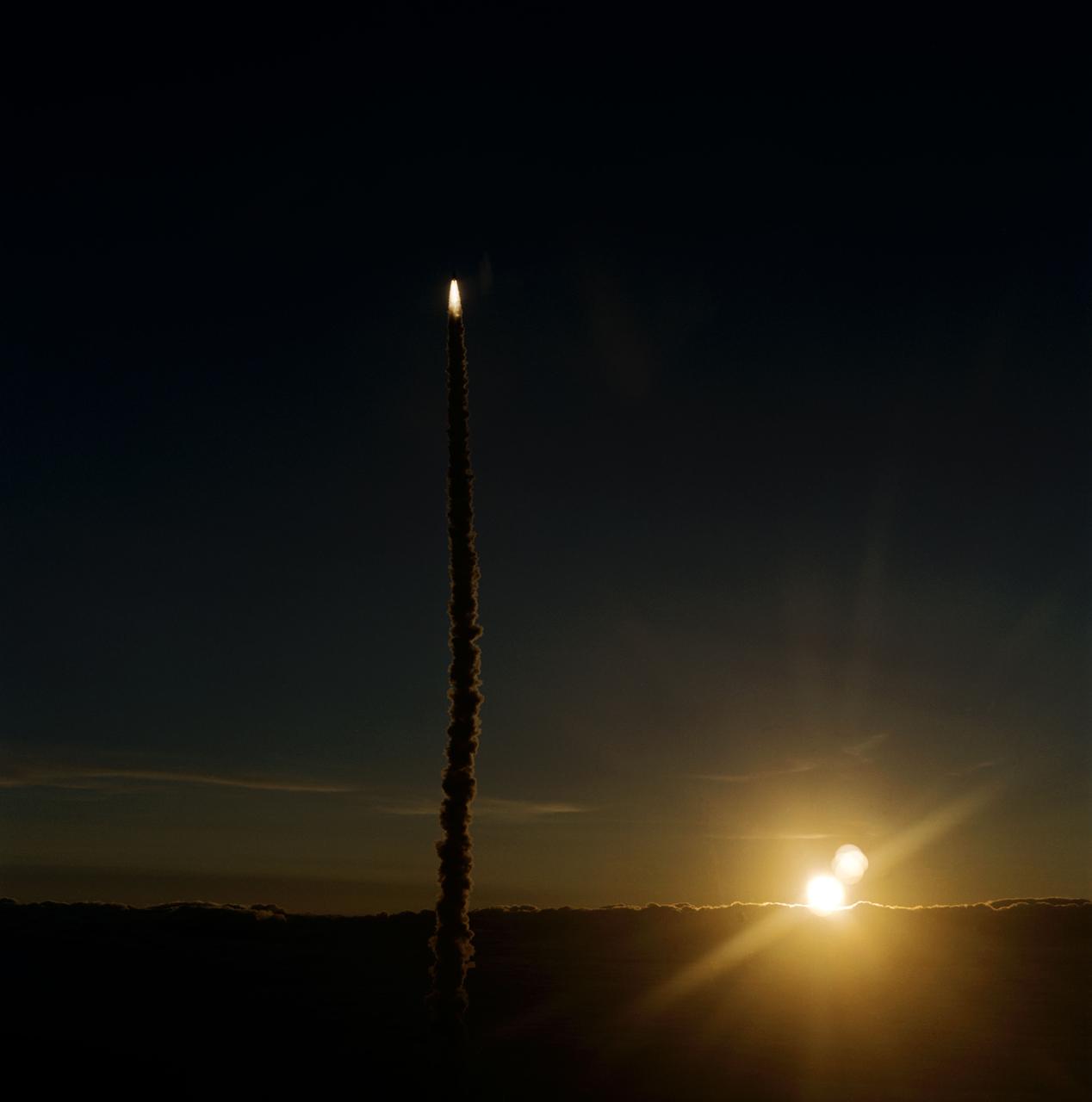 STS077-S-007 (19 May 1996) --- In this air-to-air 70mm frame, the Space Shuttle Endeavour is captured atop a trail of smoke as it carries six astronauts toward the fourth NASA Space Shuttle mission of the year.  The photograph was taken from the Shuttle Training Aircraft (STA) which routinely checks the Florida environs for weather and safety factors.  The launch occurred at 6:30:00 a.m. (EDT), May 19, 1996.  Heading the six-member crew onboard is astronaut John H. Casper, mission commander.  Other crew members are astronauts Curtis L. Brown, Jr., pilot; along with Daniel W. Bursch, Mario Runco, Jr., Andrew S. W. Thomas and Marc Garneau, all mission specialists.  Garneau represents the Canadian Space Agency (CSA).  During the approximately 10-day mission, the crew will perform a variety of payload activities, including microgravity research aboard the Spacehab 4 Module, deployment and retrieval of the Spartan 207 and deployment and rendezvous with the Passive Aerodynamically-Stabilized Magnetically-Damped Satellite (PAMS).