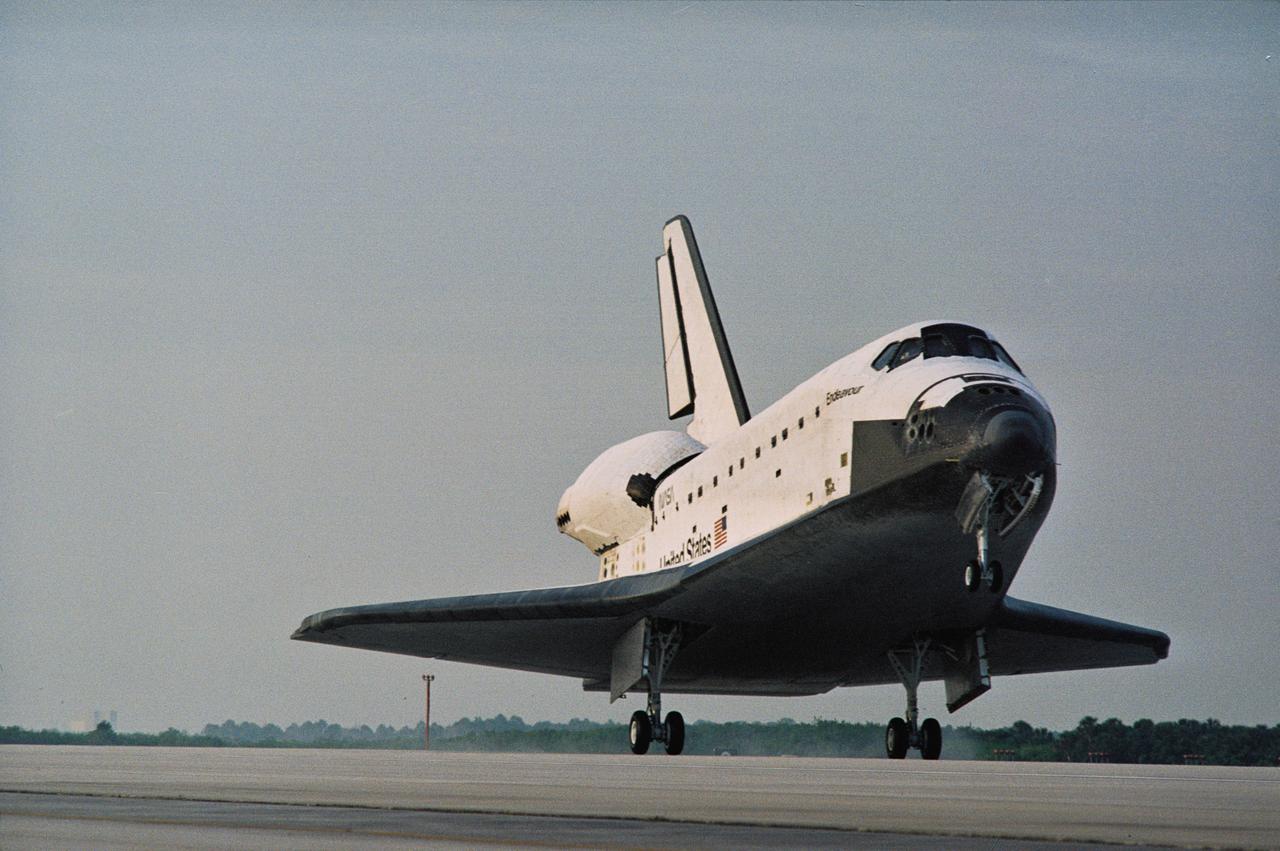 STS077-S-011 (29 May 1996) --- As its main landing gear touches down on Runway 33 at the Kennedy Space Center (KSC), the Space Shuttle Endeavour returns to Florida following a ten-day mission in space.  Touchdown came at 7:09 a.m. (EDT), May 29, 1996.  Leading the crew onboard was astronaut John H. Casper, mission commander.  Other crew members were astronauts Curtis L. Brown, Jr., pilot; along with Daniel W. Bursch, Mario Runco, Jr., Andrew S. W. Thomas and Marc Garneau, all mission specialists.  Garneau represents the Canadian Space Agency (CSA).  During the approximately 10-day mission, the crew performed a variety of payload activities, including microgravity research aboard the Spacehab 4 Module, deployment and retrieval of the Spartan 207 and deployment and rendezvous with the Passive Aerodynamically-Stabilized Magnetically-Damped Satellite (PAMS).