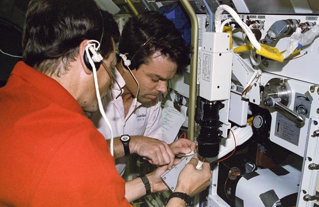 NASA image: BDPU IFM, Favier and Kregel repair a short in the experiment's wires