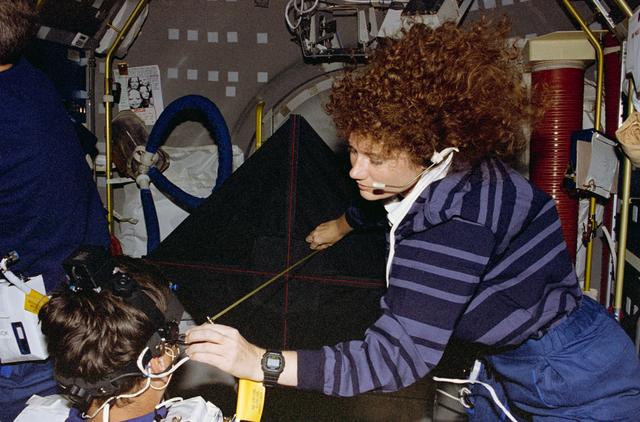 NASA image: COIS, Favier works with experiment assisted by Helms during LMS-1 mission