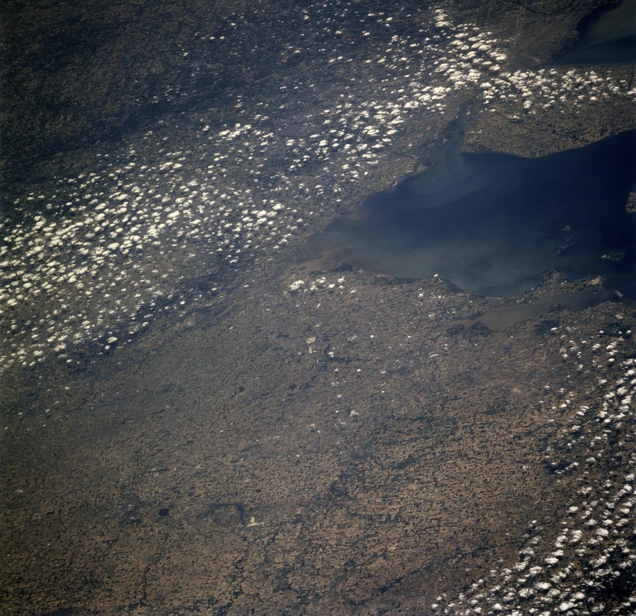 STS078-726-000A (20 June - 7 July 1996) --- Though the Space Shuttle program has been ongoing since 1981, few pictures have been taken from Earth-orbit that show the Toledo area featured in this 70mm frame from the STS-78/LMS-1 mission.  The muddy Maumee River flows through Toledo into the west end of Lake Erie.  Toledo is the seat (1835) of Lucas county, northwestern Ohio, and is a principal Great Lakes port, being the hub of a metropolitan complex that includes Ottawa Hills, Maumee, Oregon, Sylvania, Perrysburg, and Rossford.  Fort Industry (1803-05) was located at the mouth of Swan Creek (now downtown Toledo), where permanent settlement was made after the War of 1812.  Two villages, Port Lawrence (1817) and Vistula (1832), were consolidated in 1833 and named for Toledo, Spain.  The united community was incorporated as a city in 1837.  Its population in 1990 was 332,943.  There are many smaller Ohio cities in the photo including Bowling Green, Findlay, Tiffin, Fremont, Fostoria, and Sandusky (right edge).