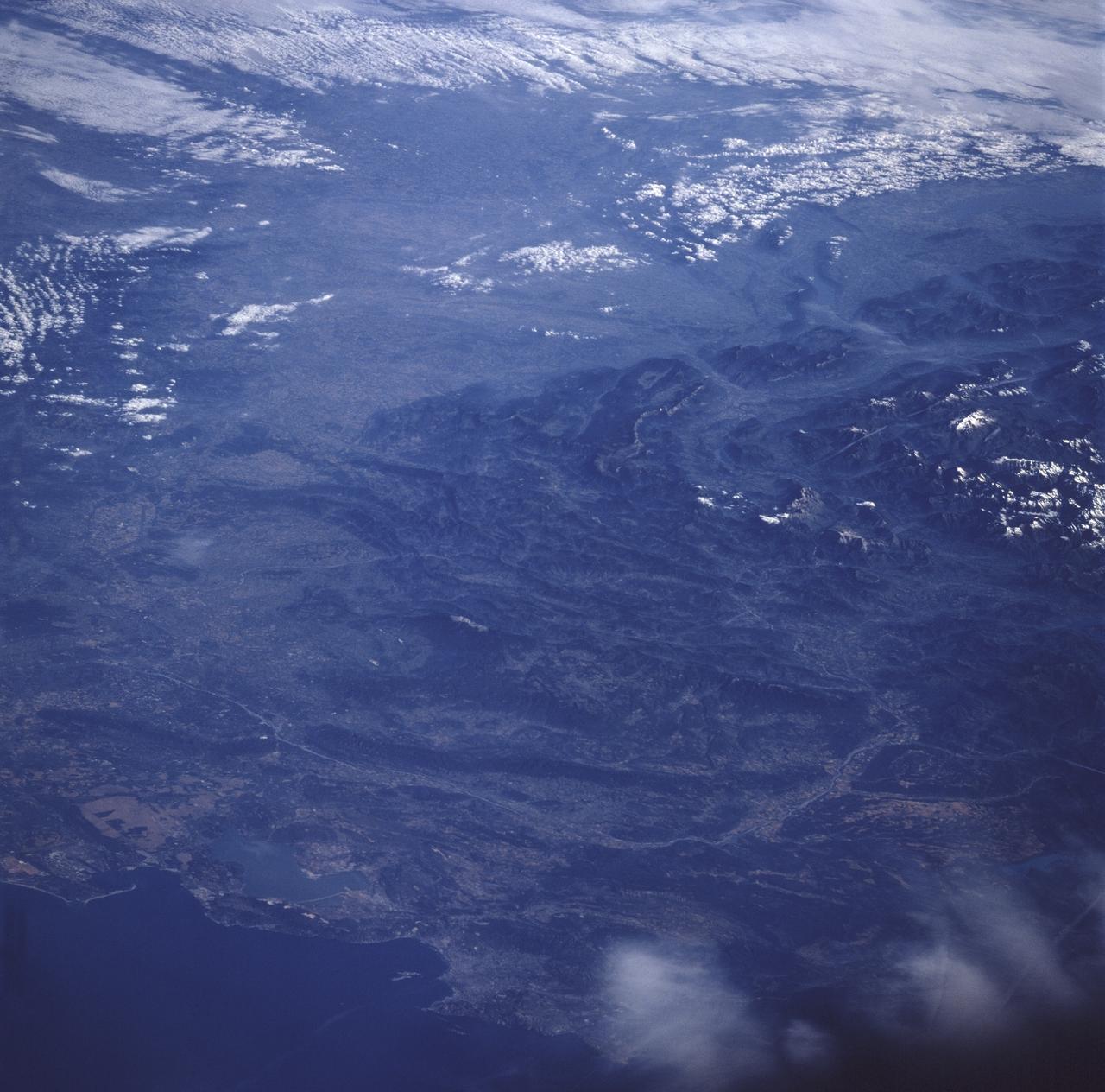 STS078-752-050 (20 June - 7 July 1996) --- A large portion of southeastern France is depicted in this view. The pictured area extends from the port of Marseilles northeastward over the Alps to Lake Geneva in the upper right hand corner. Marseilles is the second largest city proper (population in 1990 was 807,726) and the largest commercial seaport of France and since 1970 it has rivaled Rotterdam as a transit port for all of Europe. It is situated on the Mediterranean's Gulf of Lion within a semicircle of limestone hills. Settled by Greeks from Asia Minor during the 7th century BC, Marseilles is the oldest of France's major cities.