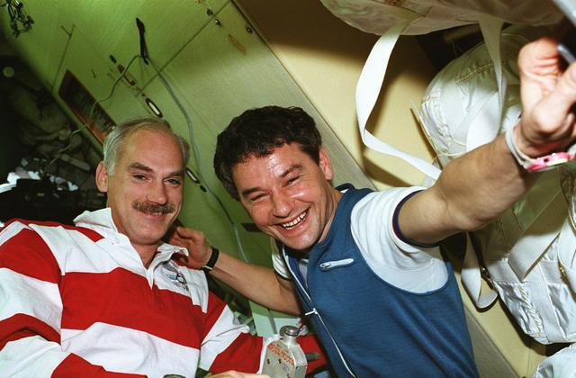 NASA image: STS-79 and Mir cosmonauts in the docking module prior to undocking