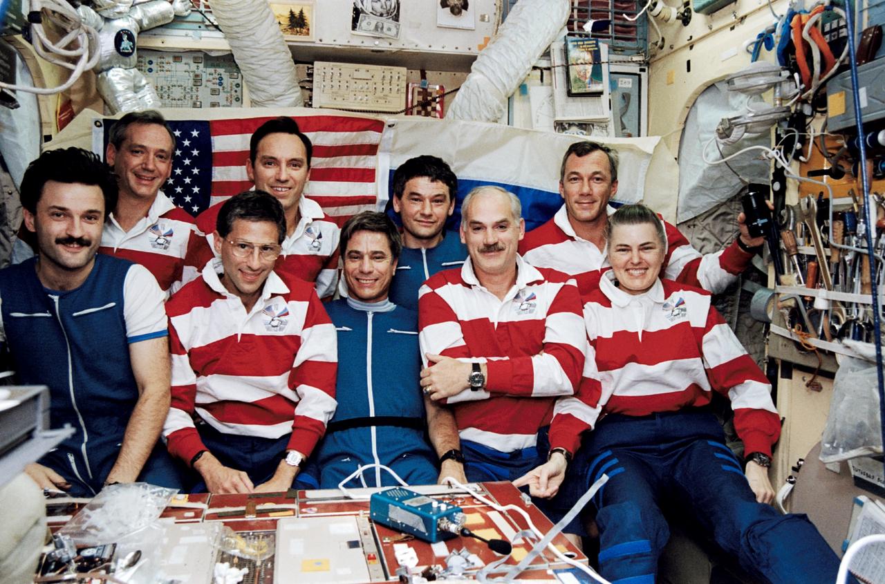 STS079-349-022 (16-26 Sept. 1996) --- The traditional inflight crew portrait, taken in Russia's Mir Space Station base block.  Front row, left to right, Aleksandr Y. Kaleri, Jerome (Jay) Apt, John E. Blaha, William F. Readdy and Shannon W. Lucid.  Back row, left to right, Thomas D. Akers, Carl E. Walz, Valeri G. Korzun and Terrence W. Wilcutt.  This photograph is one of fifteen 35mm frames (along with four 70mm frames) of still photography documenting the activities of NASA's STS-79 mission, which began with a September 16, 1996, liftoff from Launch Pad 39A the Kennedy Space Center (KSC) and ended with a landing at KSC on September 26, 1996.  Onboard for the launch were astronauts Readdy, commander; Wilcutt, pilot; Blaha, Apt, Akers and Walz, all mission specialists.  On flight day 4, the crew docked with the Mir Space Station.  Lucid, who had spent six months aboard Mir, switched cosmonaut guest researcher roles with Blaha.  The latter joined fellow Mir-22 crewmembers Korzun, commander, and Kaleri, flight engineer.