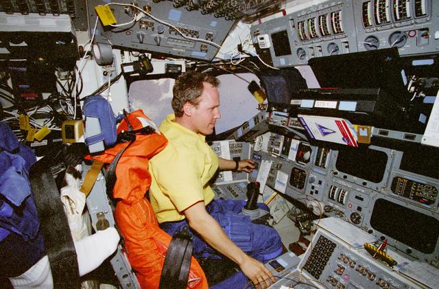 NASA image: Mission Specialist Tom Jones performs stationkeeping ops in the flight deck