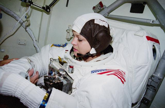 NASA image: Extravehicular Activity suitup procedures during STS-80 mission