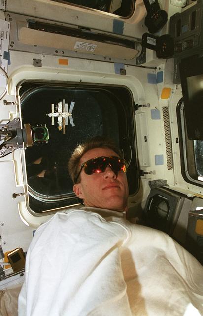 NASA image: STS-81 pilot Jett on aft flight deck during approach to Mir