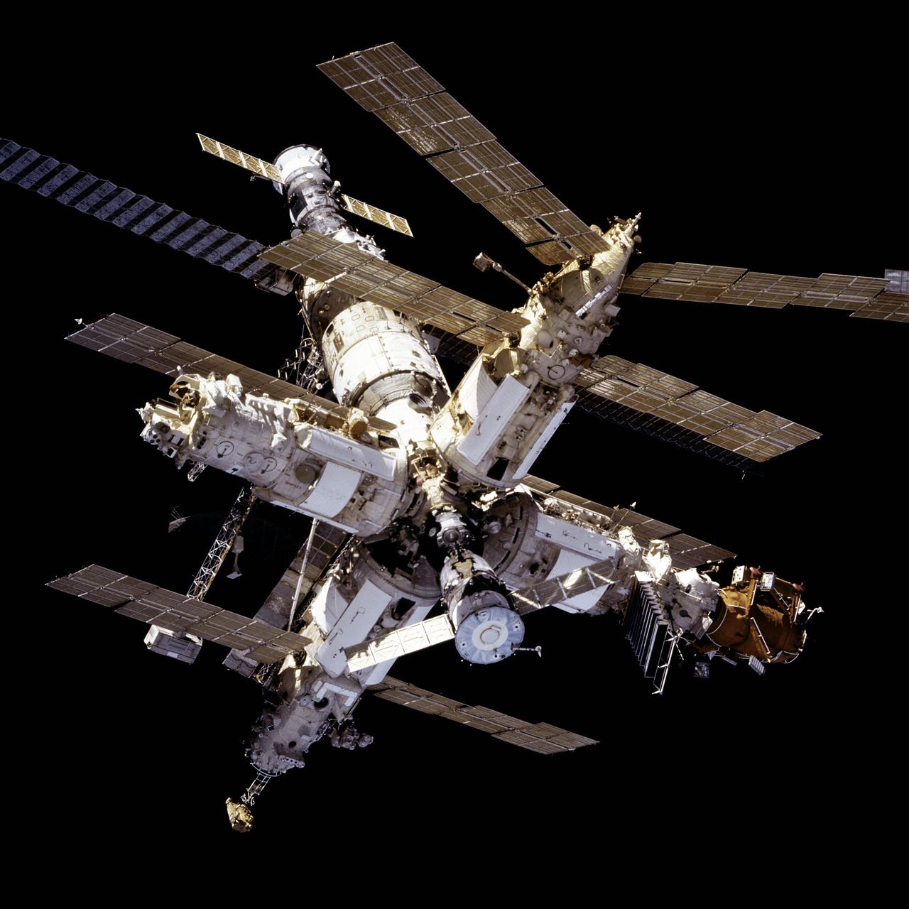 STS081-736-034 (14 Jan 1997) --- This 70mm frame affords a full view of Russia?s Mir Space Station complex during approach for docking, backdropped against the blackness of space.  Astronaut Jerry M. Linenger, now onboard the Space Shuttle Atlantis, will trade places with John E. Blaha, current cosmonaut guest researcher onboard Mir since mid September 1996.  Along with Linenger, other crew members now aboard Atlantis are astronauts Michael A. Baker, commander; Brent W. Jett, Jr., pilot; and mission specialists John M. Grunsfeld, Marsha S. Ivins and Peter J. K. (Jeff) Wisoff.
