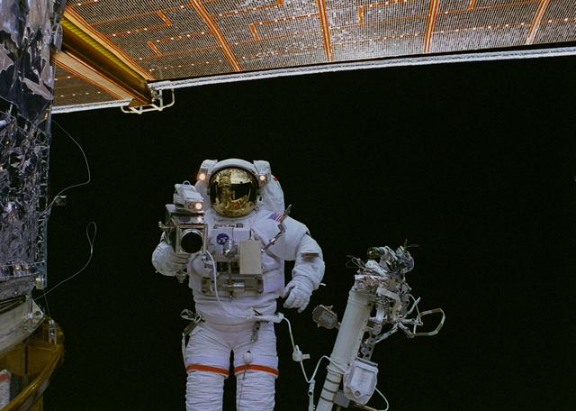 NASA image: EVA 5 activity on Flight Day 7 - handheld camera views