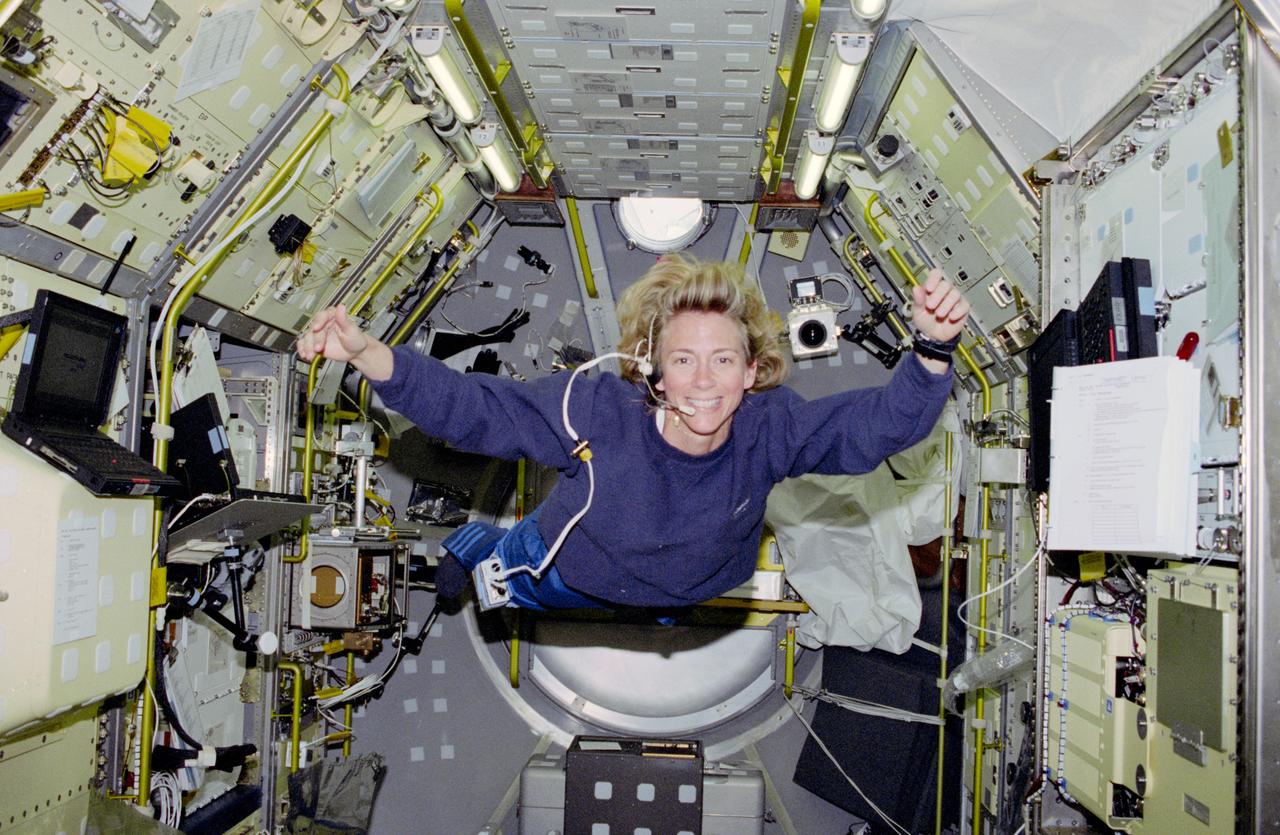 STS083-303-002 (4-8 April 1997) --- Astronaut Susan L. Still, pilot, floats into the Spacelab Module in the early phases of its activation.  Still, a member of the 1995 astronaut class, joined four other NASA astronauts and two scientist payload specialists for the Microgravity Science Laboratory 1 (MSL-1) mission aboard the Earth-orbiting Space Shuttle Columbia.
