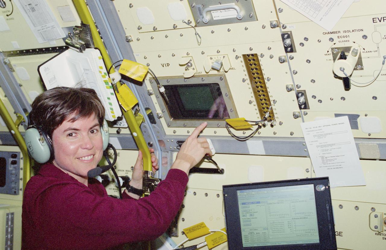 STS083-305-017 (4-8 April 1997) --- Astronaut Janice E. Voss, payload commander, displays a pleasant countenance following a successful test at the Combustion Module-1 (CM-1).  The test was designed to study the Structures of Flame Balls at Low Lewis (SOFBALL) numbers.  The CM-1 facility accommodates a number of experiments using different chamber inserts.