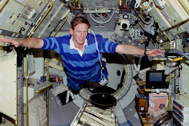 NASA image: Candid views of Crouch and Gernhardt in the Spacelab module
