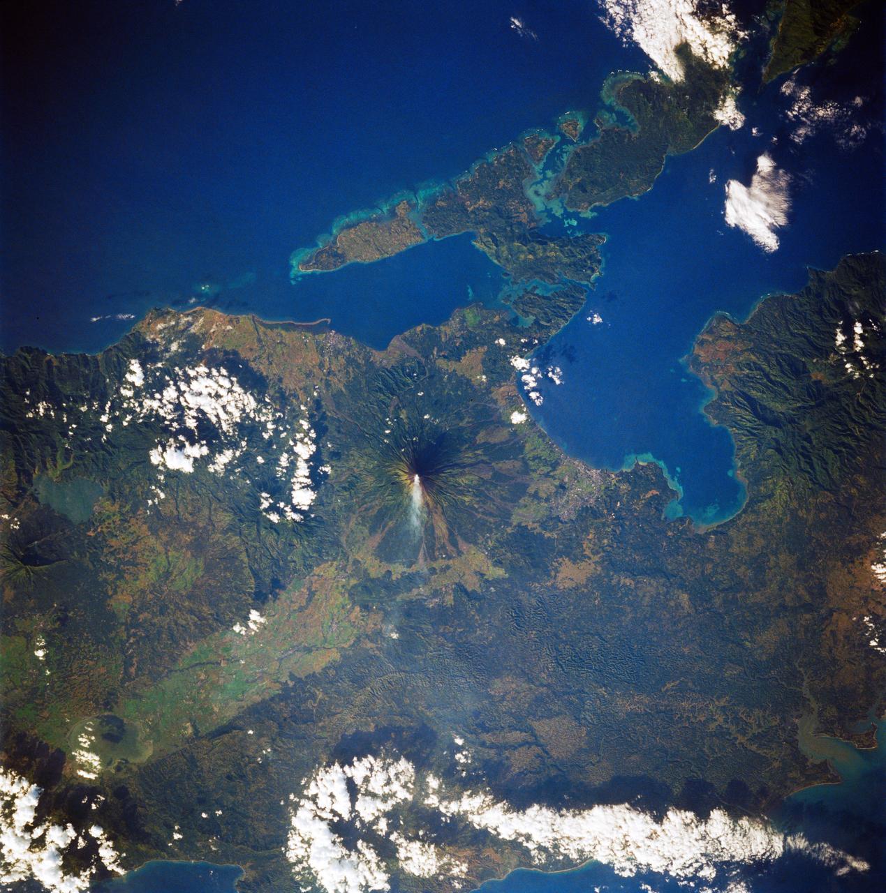 STS083-747-088 (4-8 April 1997)--- Mayon Volcano with a Plume, Luzon, the Philippines Mayon has the classic conical shape of a strato volcano.  It is the most active volcano in the Philippines and continues to be active as demonstrated by the plume in the photo.  Since 1616, Mayon has erupted 47 times.  The most recent major eruption, in 1993, began unexpectedly with an explosion.  The initial eruption lasted only 30 minutes but it generated pyroclastic flows that killed 68 people and prompted the evacuation of 60,000 others.